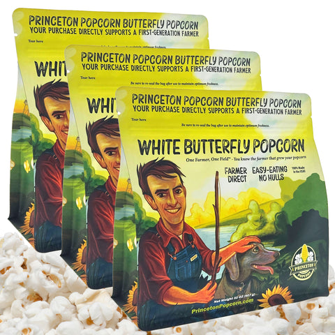 Three 2 lb bags of Princeton Popcorn White Butterfly Popcorn stacked as a 6 lb pack