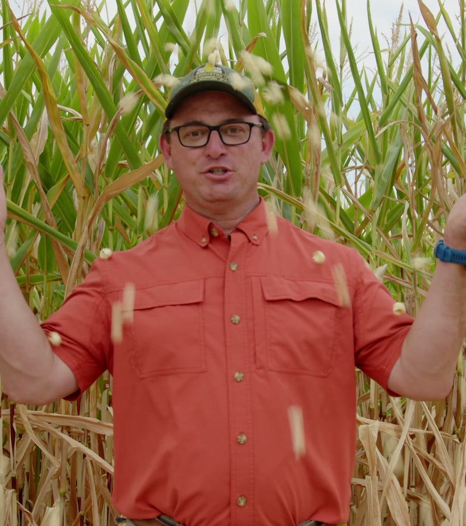 Farmer Bob in his popcorn field in Princeton, Kansas, with kernels falling around him