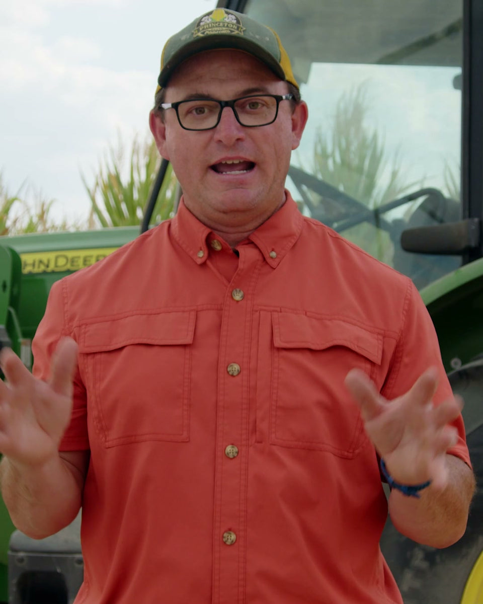 Farmer Bob talking to the camera in front of his tractor and popcorn field in Princeton, Kansas